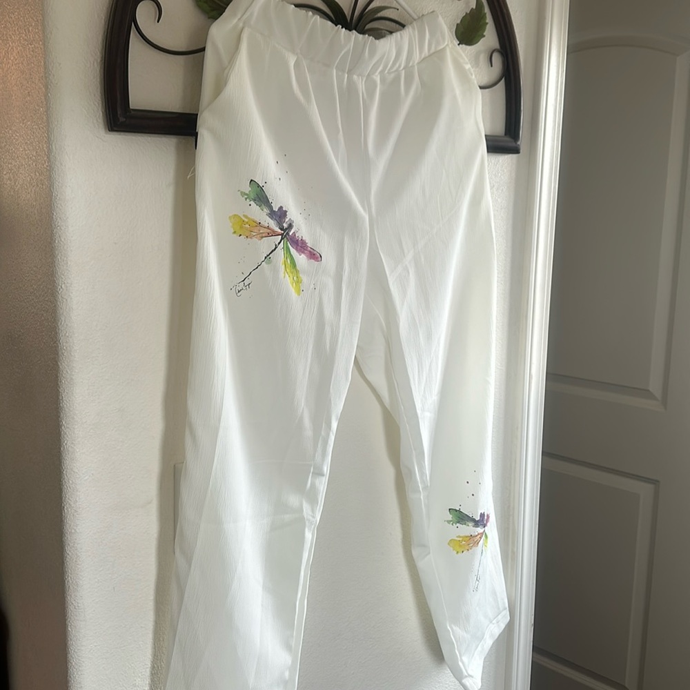 White linen pants with dragon fly